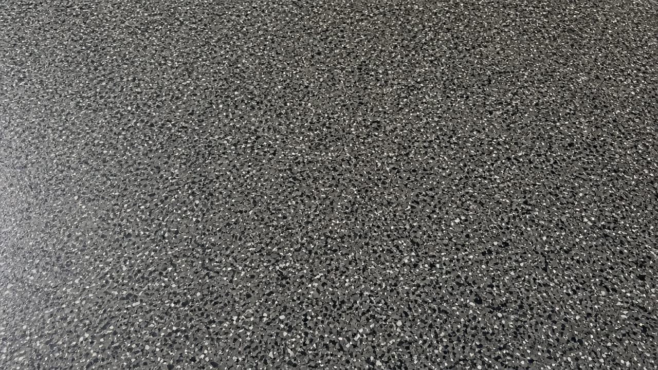 Grey and white epoxy flake floor, full broadcast