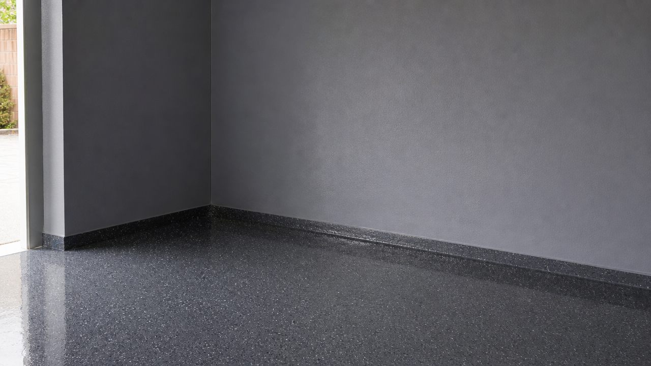 Coated garage walls meeting a gloss flake floor